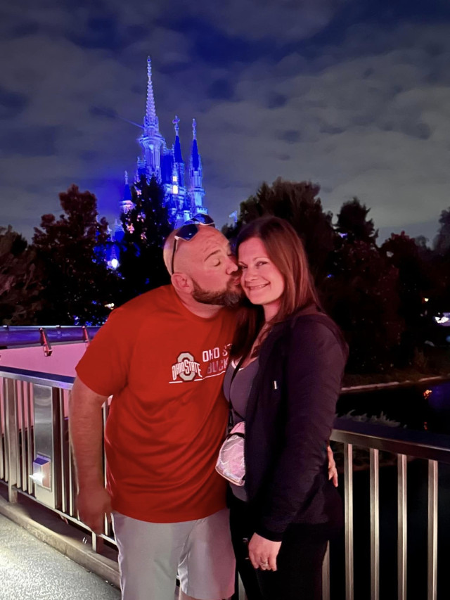 Mom and dad kissing at Disney