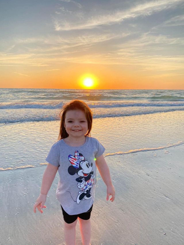Brooke in Front of Ocean as Sun Sets