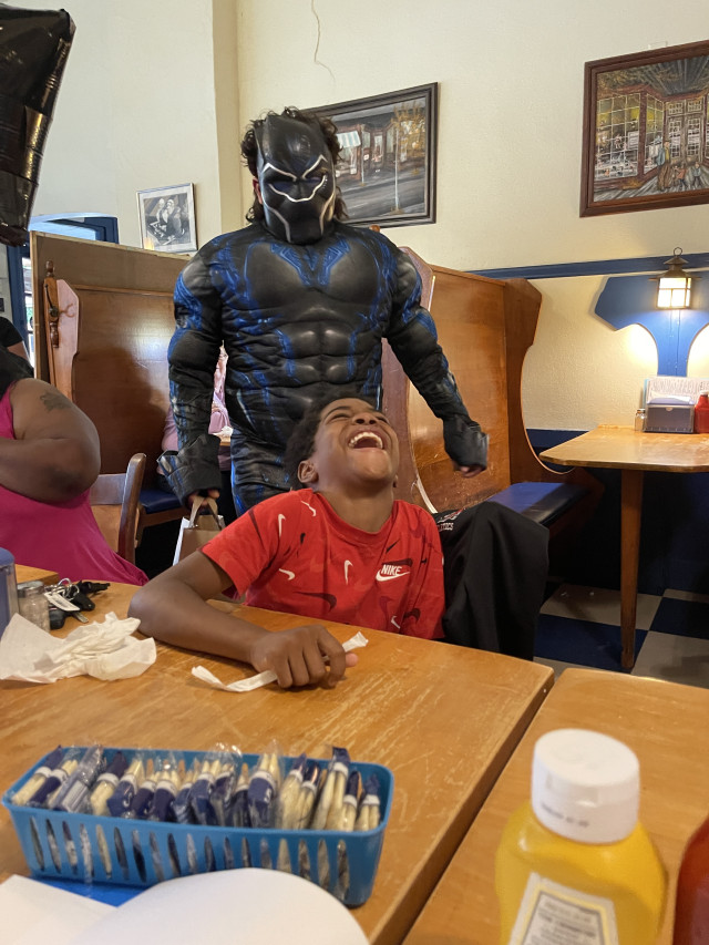Kyree Laughing with Black Panther