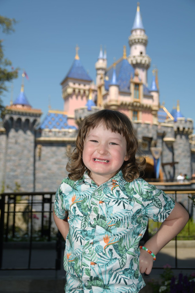 Kyler in Front of Disneyland Castle