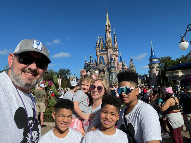 Elise and Family in Front of Disney Castle