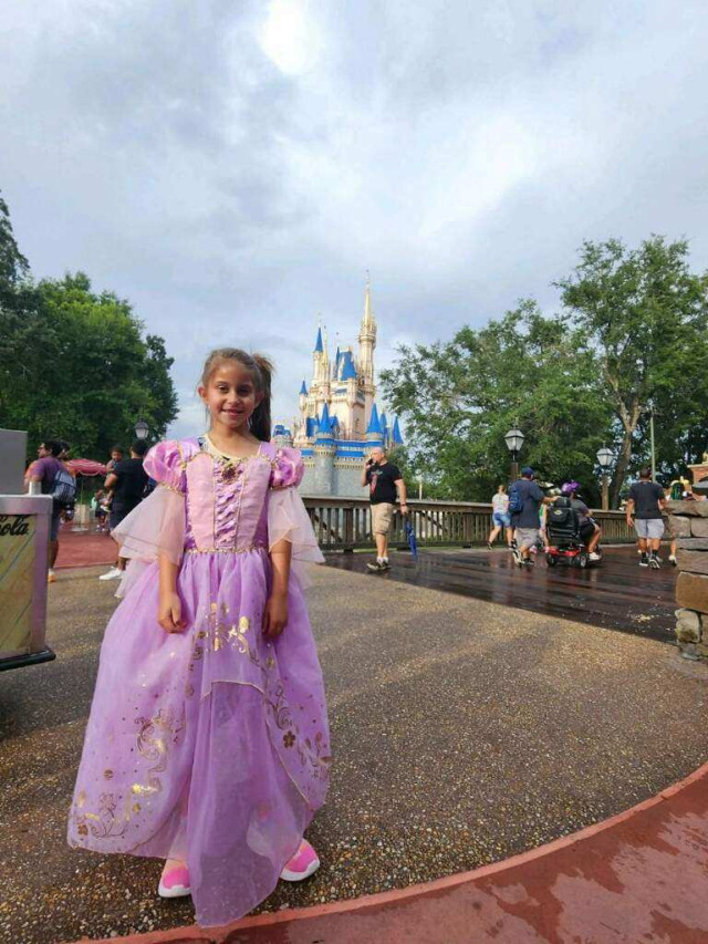 Melina in Front of Castle at Disney