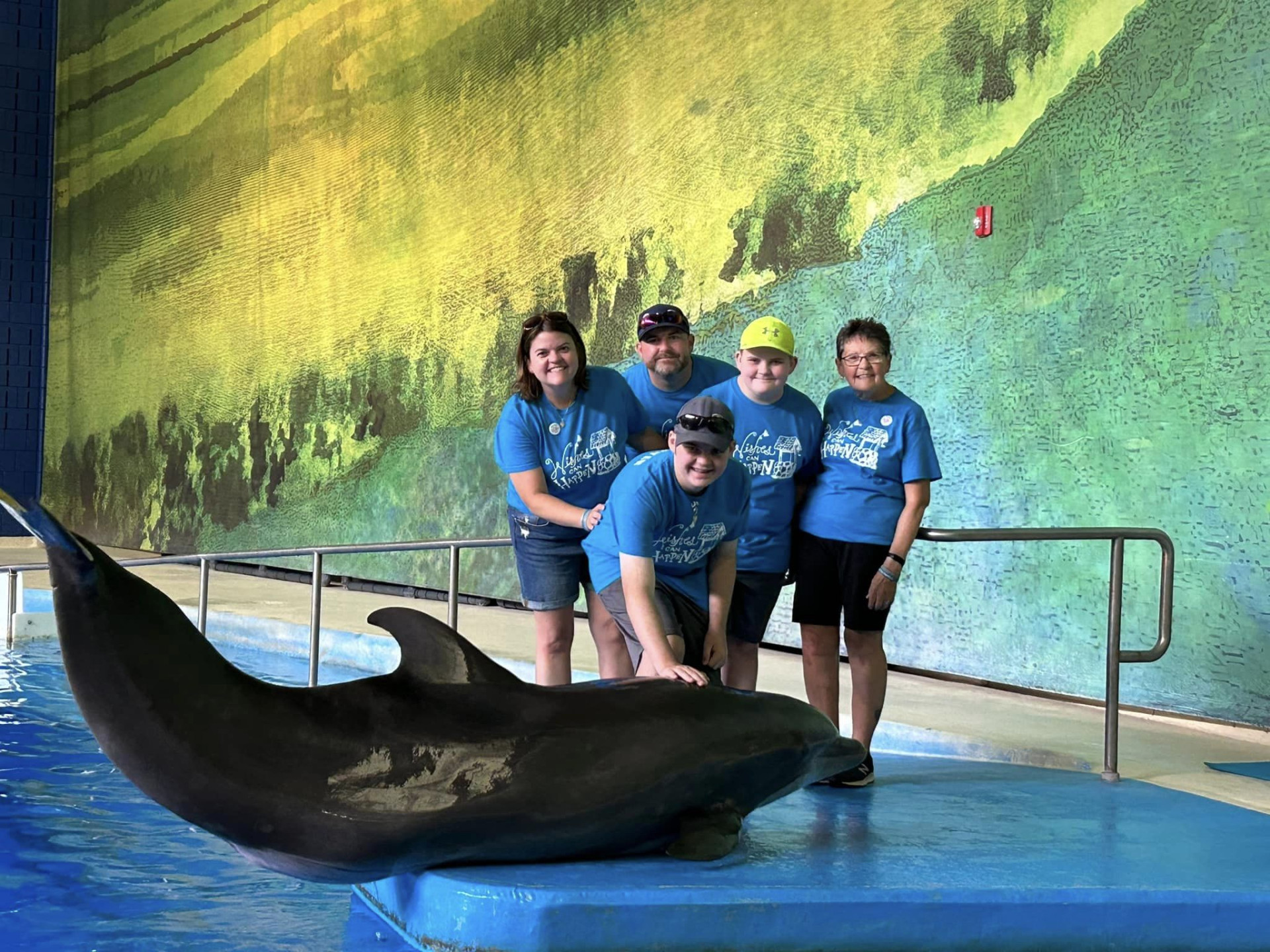 Aaron and Family with dolphin at Indy Zoo