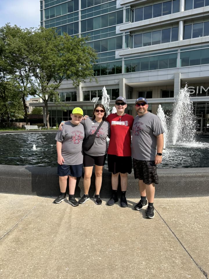 Family in Front of Hyatt Waterfall