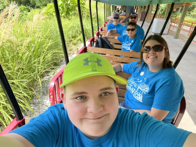 Family on Tram at zoo w WCH shirts