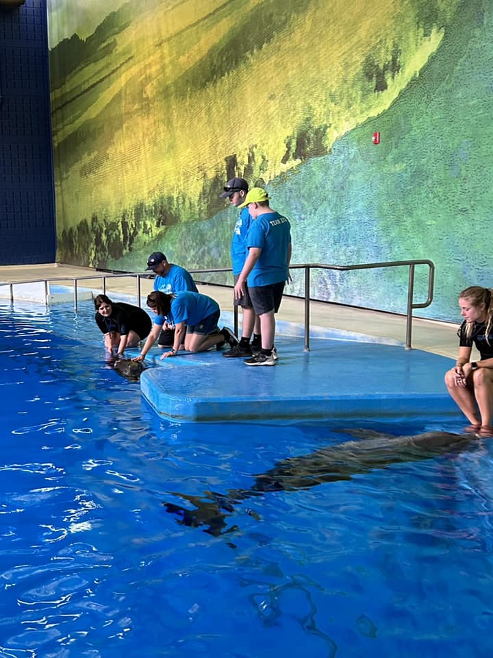 Family w Dolphin Trainer