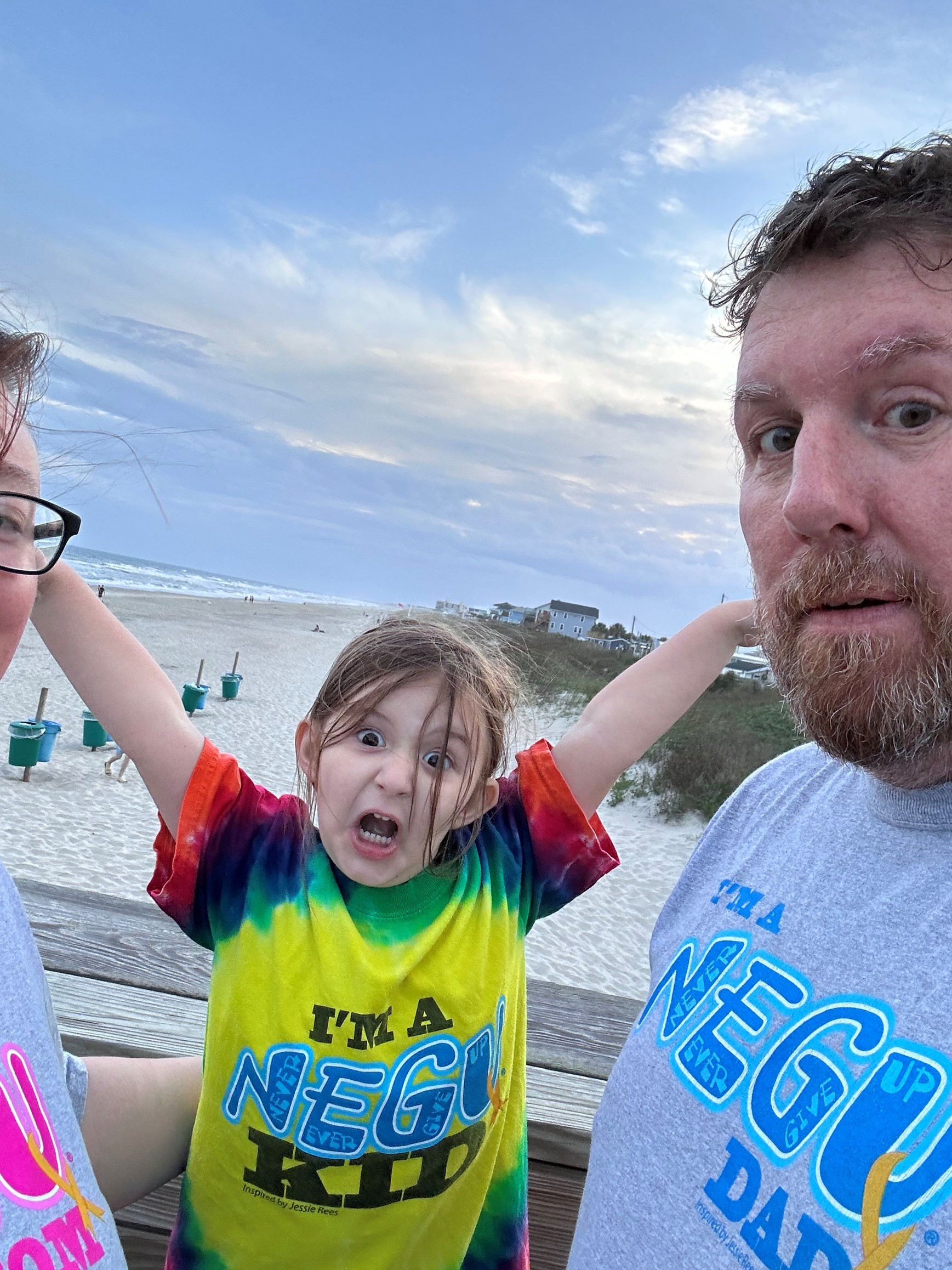 Charlie at Beach with Arms Up