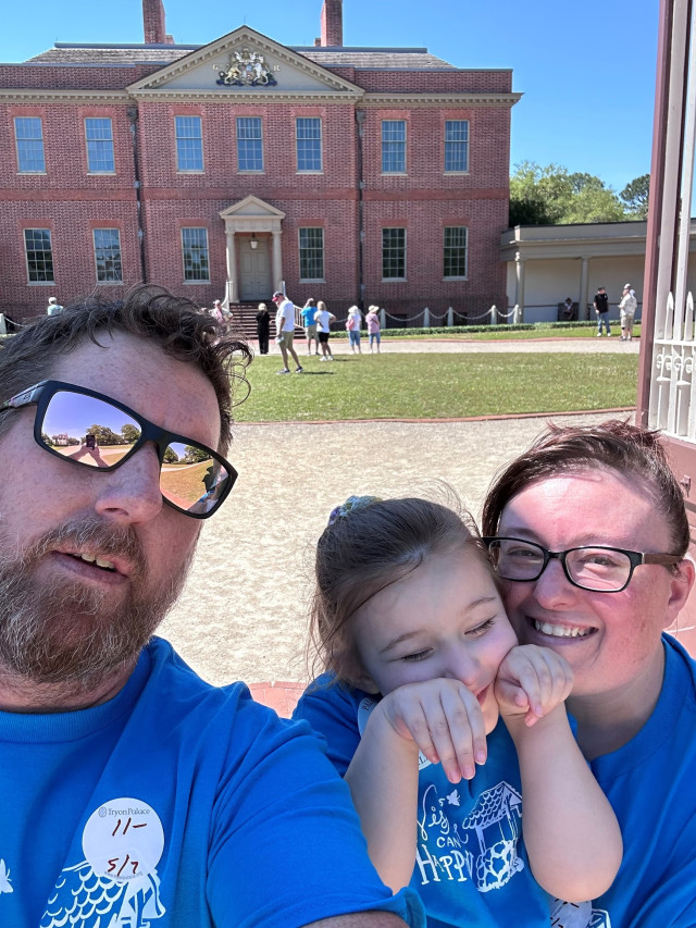 Family in Front of Building