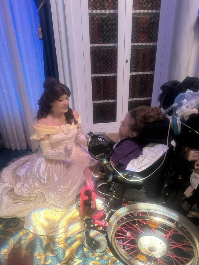 Evie with Belle at Disney