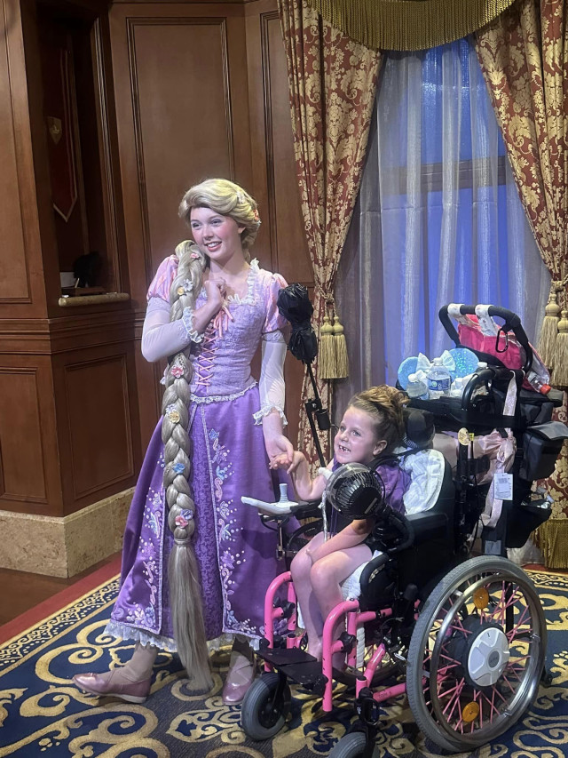 Evie with Rapunzel at Disney