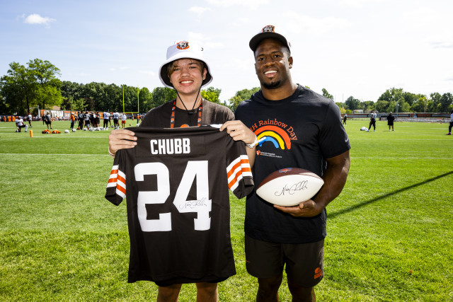 Nick Chubb and Julian on Field with Jersey from Browns