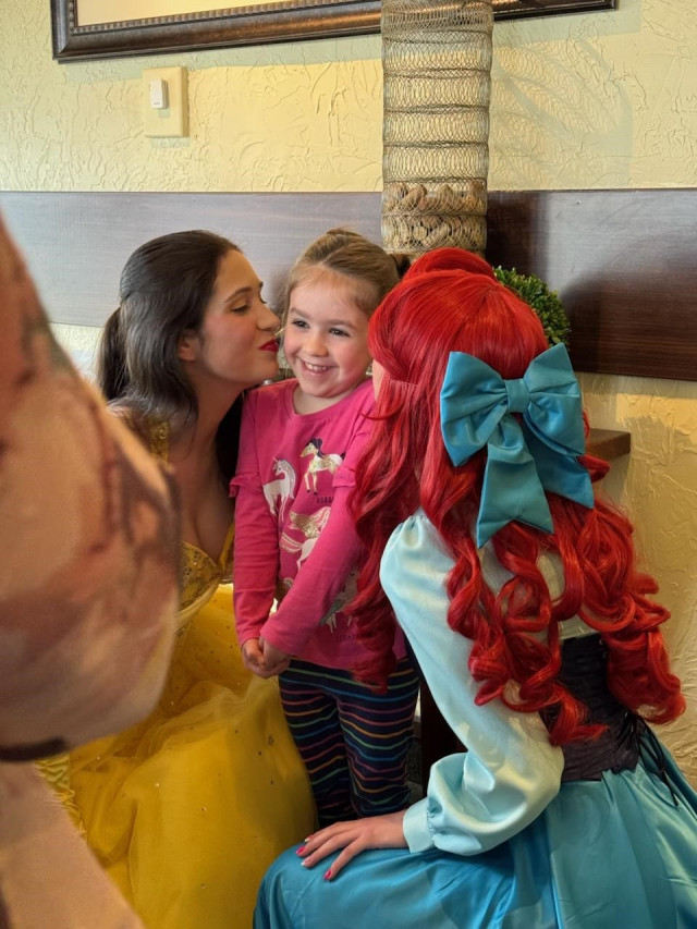 Lily getting kiss from princesses