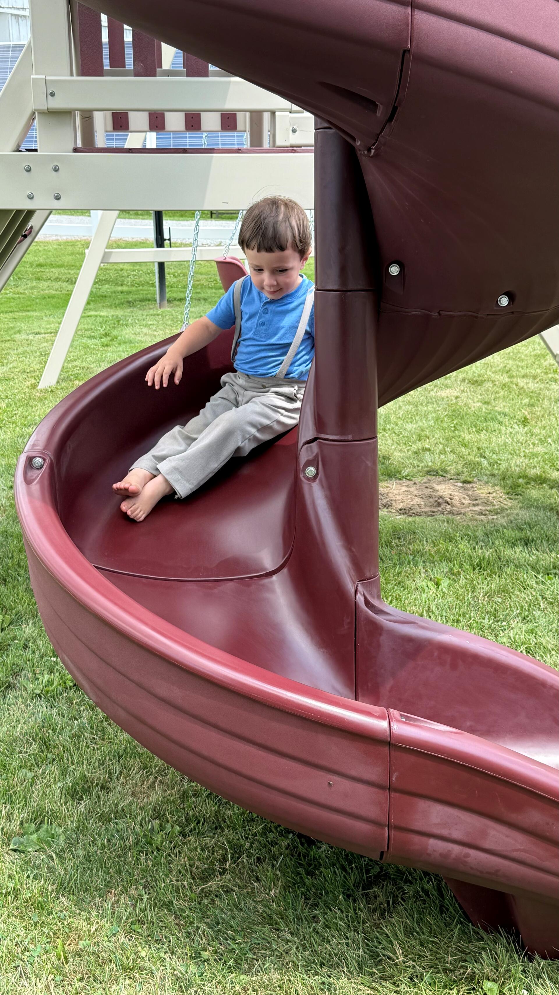 Closeup Isaac Yoder Going Down Slide