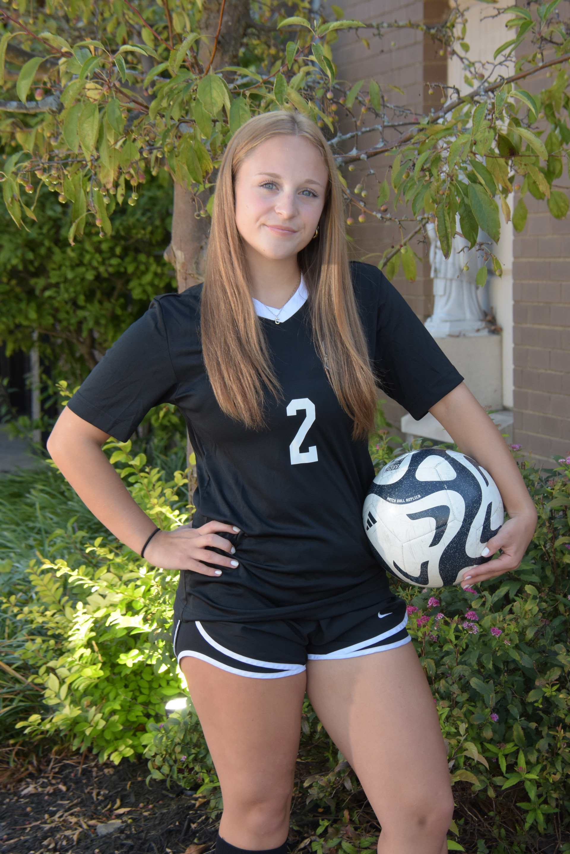 Clara Standing w Jersey and Ball