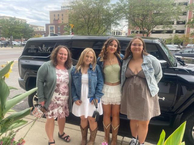 Group in front of Hummer