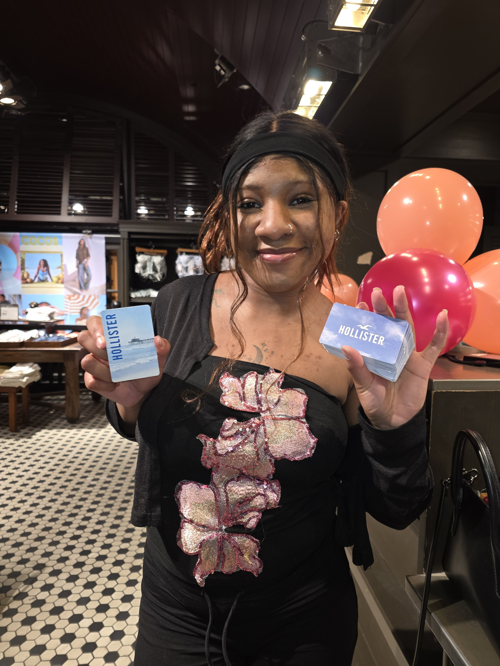 LaNiya with Pile of Hollister Gift Cards