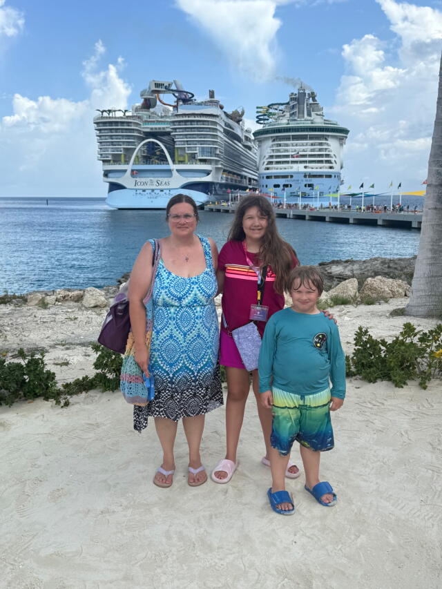 Family in front of ship