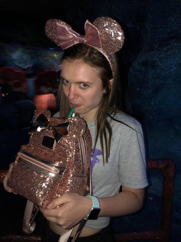 Kendall Taking Drink at Disney